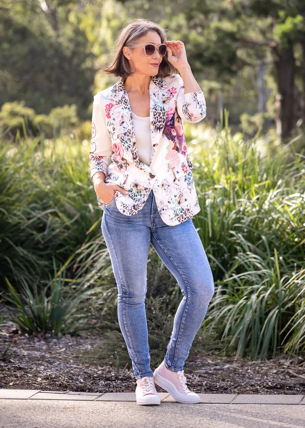 Aeris Jacket in Blush, featuring a tailored silhouette with full-length sleeves, striking animal print artwork on the front, and a vibrant scenic print on the back. Crafted from a soft polyfibre blend with a fully lined interior and faux front pockets for a polished, contemporary finish.