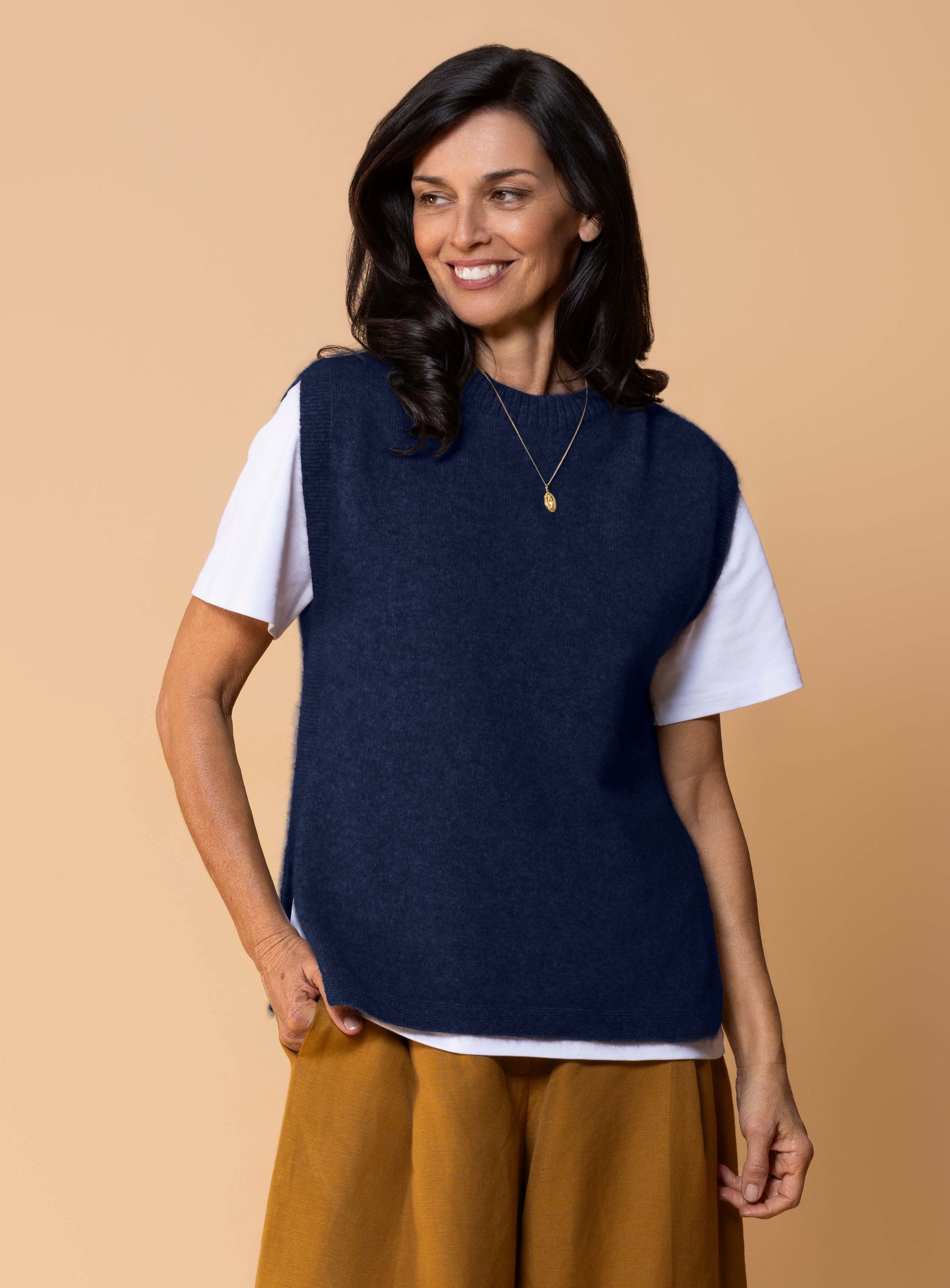 Women's Kowhai Vest in Maritime, deep blue possum merino knit sleeveless vest with round neckline, side splits and relaxed fit for layering.