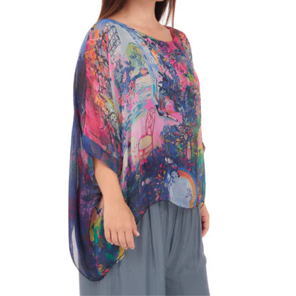 Blue Italian silk top with a relaxed fit and soft drape, lightweight and elegant with a fluid silhouette.