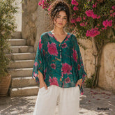 Bottiglia green Italian silk button-up top with a V-neckline, relaxed fit, and soft flowing overlay in a deep green tone.