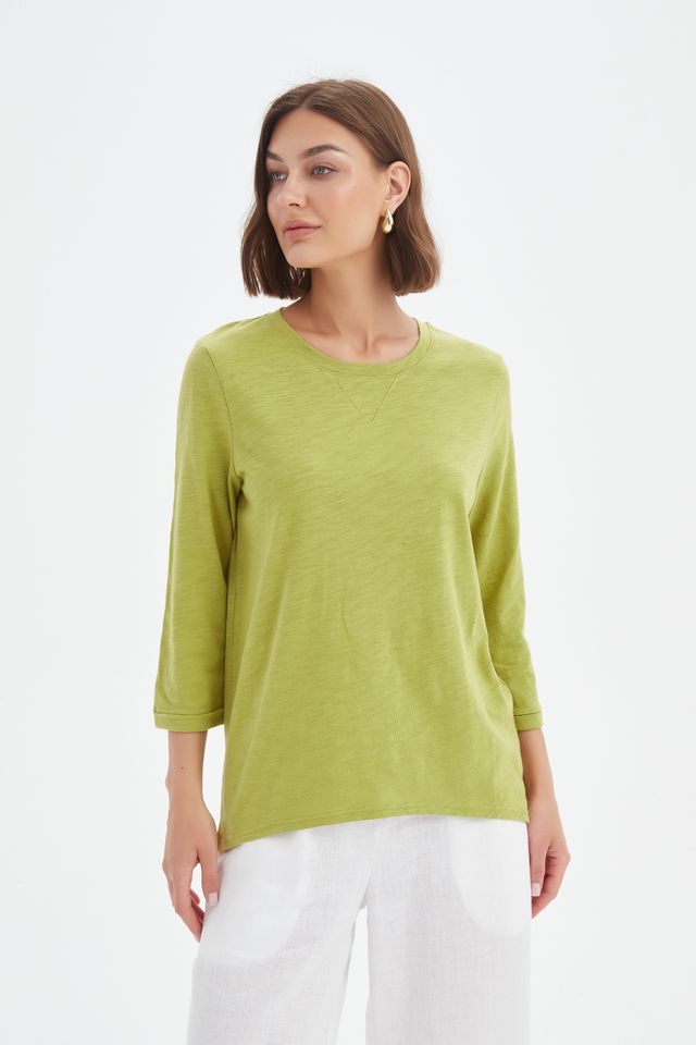 Chartreuse cotton slub tee featuring a round neckline with V-insert detail, 3/4 sleeves, relaxed fit, and curved hem.