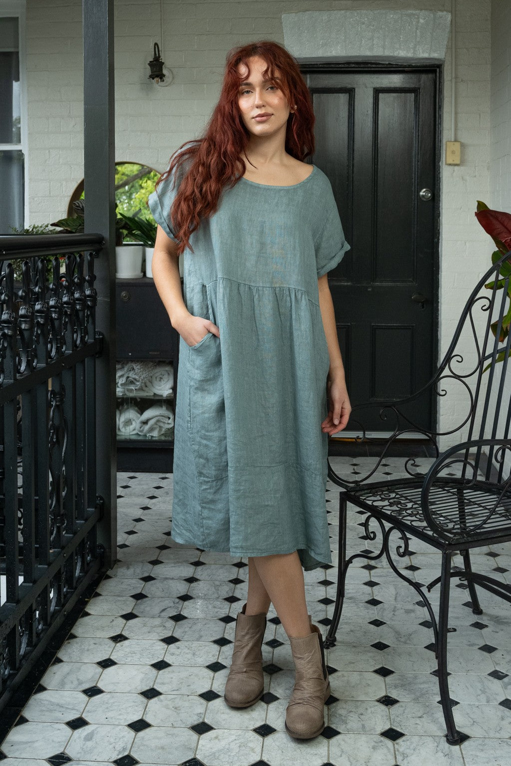 Linen dress with gathered yoke, short cuffed sleeves, angled side pockets, and deep hemline panel — timeless design in Powder Blue now at Linens & Treasures