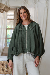 Juniper green linen bomber jacket with cape sleeves, zip front, wide collar and ruched waist