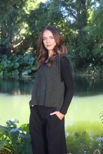 Lothlorian Ride Vest in Moss, crafted from premium Possum Merino knit with a V-neckline, ribbed drop hem, overlapping side vents and a relaxed layering silhouette.