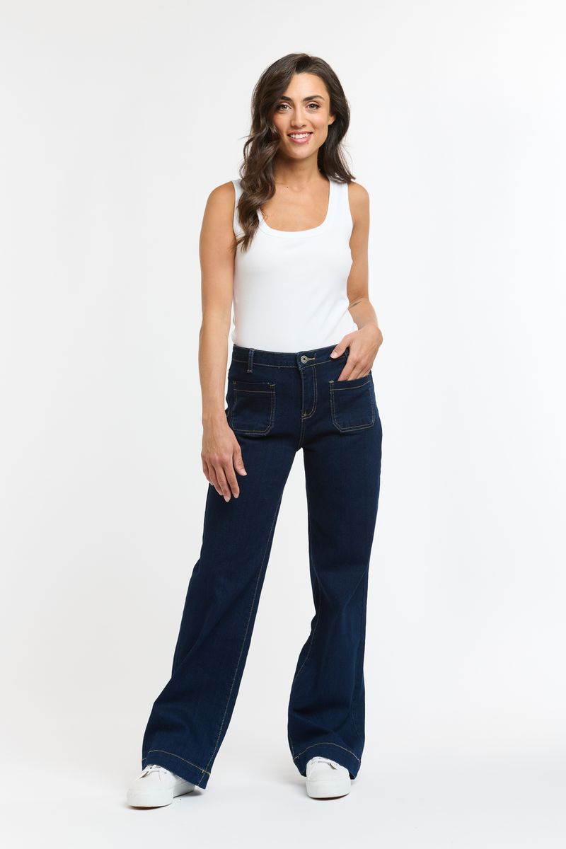 Blue denim barrel leg jeans with curved silhouette and tapered ankle
