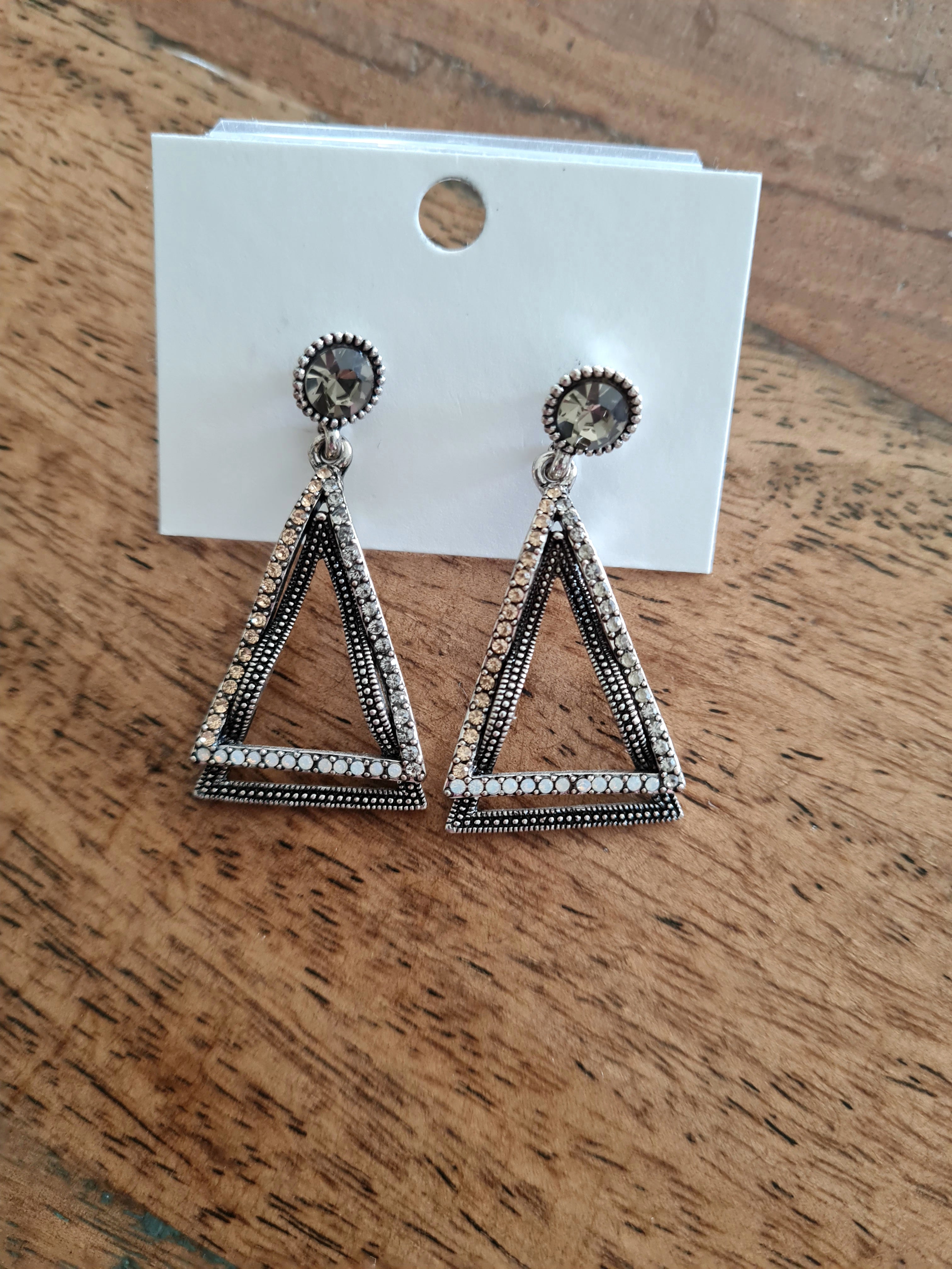 Layered triangular earrings featuring old gold marcasite and crystals in clear to soft gold tones, topped with a khaki crystal. Buy these gorgeous earings at Linens & Treasures