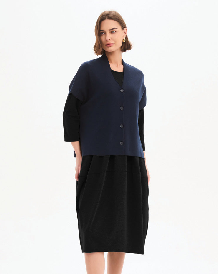Tirelli Button Up Vest in a soft cotton-nylon knit featuring a V-neckline, button-front closure, relaxed dropped shoulder sleeves, and an effortless silhouette ideal for layering and everyday wear.