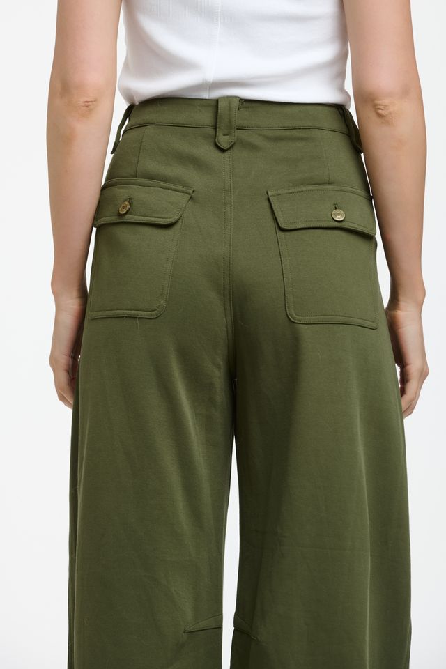 Italian Star PIMMS Pant in Khaki featuring a relaxed high-rise fit with a modern wide-leg barrel silhouette. Crafted in a stretch cotton blend, these slouchy pants feature a unique front pocket panel detail, belt loops, zip fly, and cargo-style patch pockets on the back for an effortless contemporary look.