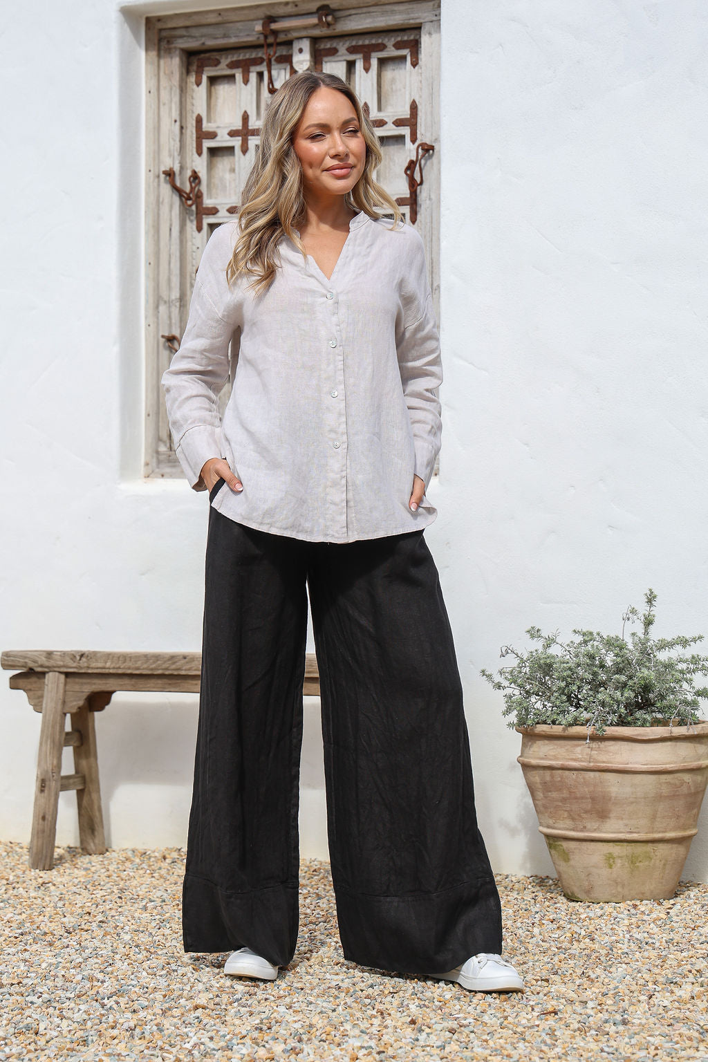 Black linen wide-leg pants with elastic tie waist and side pockets