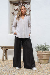 Black linen wide-leg pants with elastic tie waist and side pockets