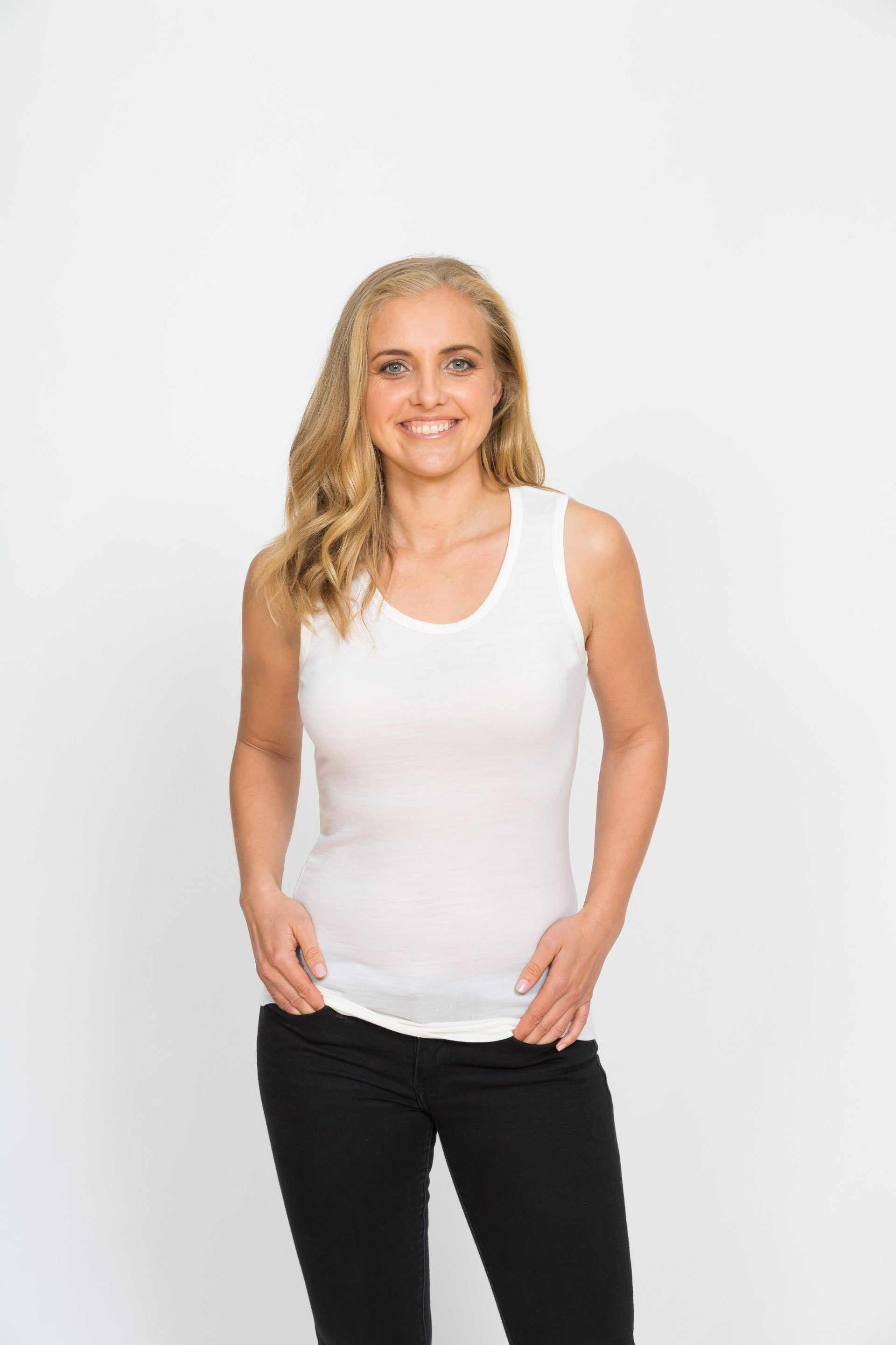 Pearl white merino reversible singlet with V-neck and scoop neck options, smooth jersey knit fabric, and lightweight fitted silhouette.