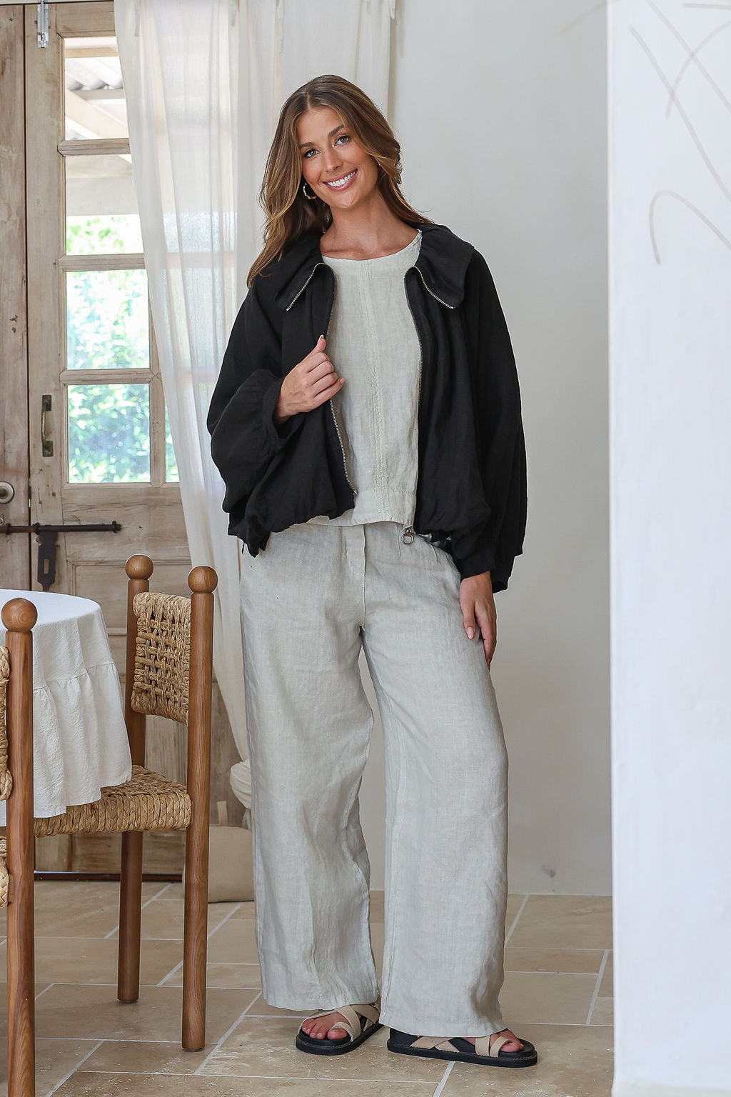 Black linen bomber jacket with cape sleeves, zip front, wide collar and ruched waist