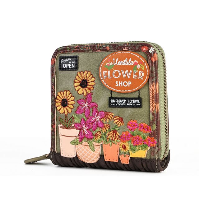Vendula London Flower Shop Amber Edition Square Wallet in printed and embossed vegan leather, featuring a charming flower shop window design with warm amber tones, potted blooms, leafy details and seasonal floral colours. Compact design with a secure ziparound fastening, six card slots, a coin compartment and a section for notes.