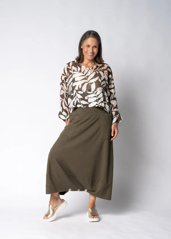 Moss green skirt with relaxed flowing silhouette, soft drape and comfortable everyday fit