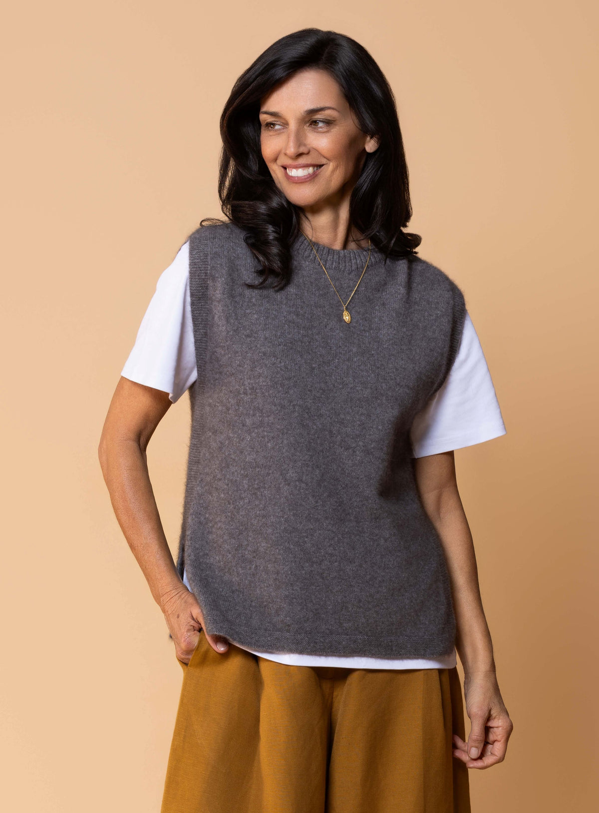 Women's Kowhai Vest in Shale, soft grey possum merino knit sleeveless vest with round neckline, side splits and relaxed fit for layering.