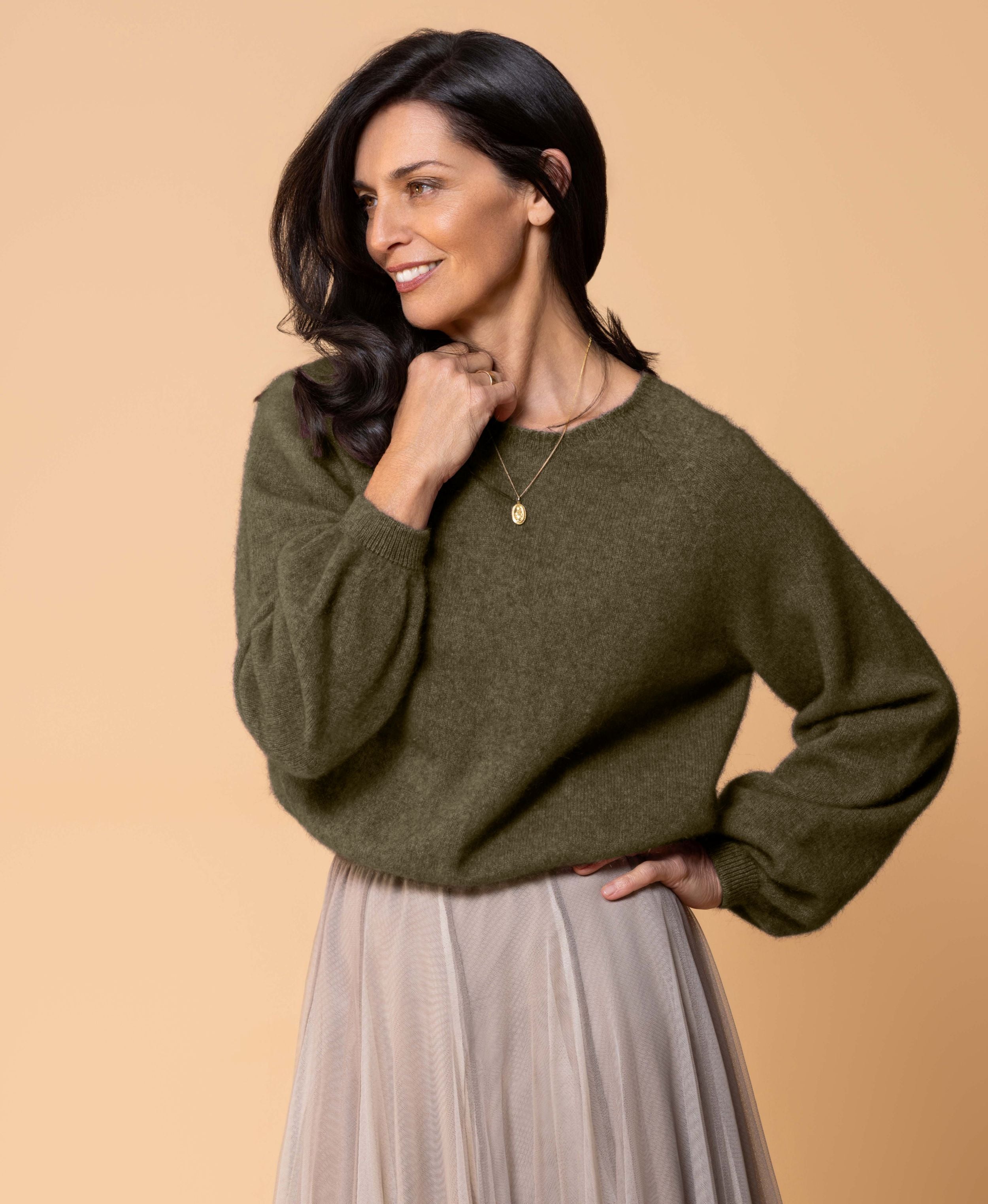 Classic button cardigan in soft possum merino blend with clean neckline and fitted shape