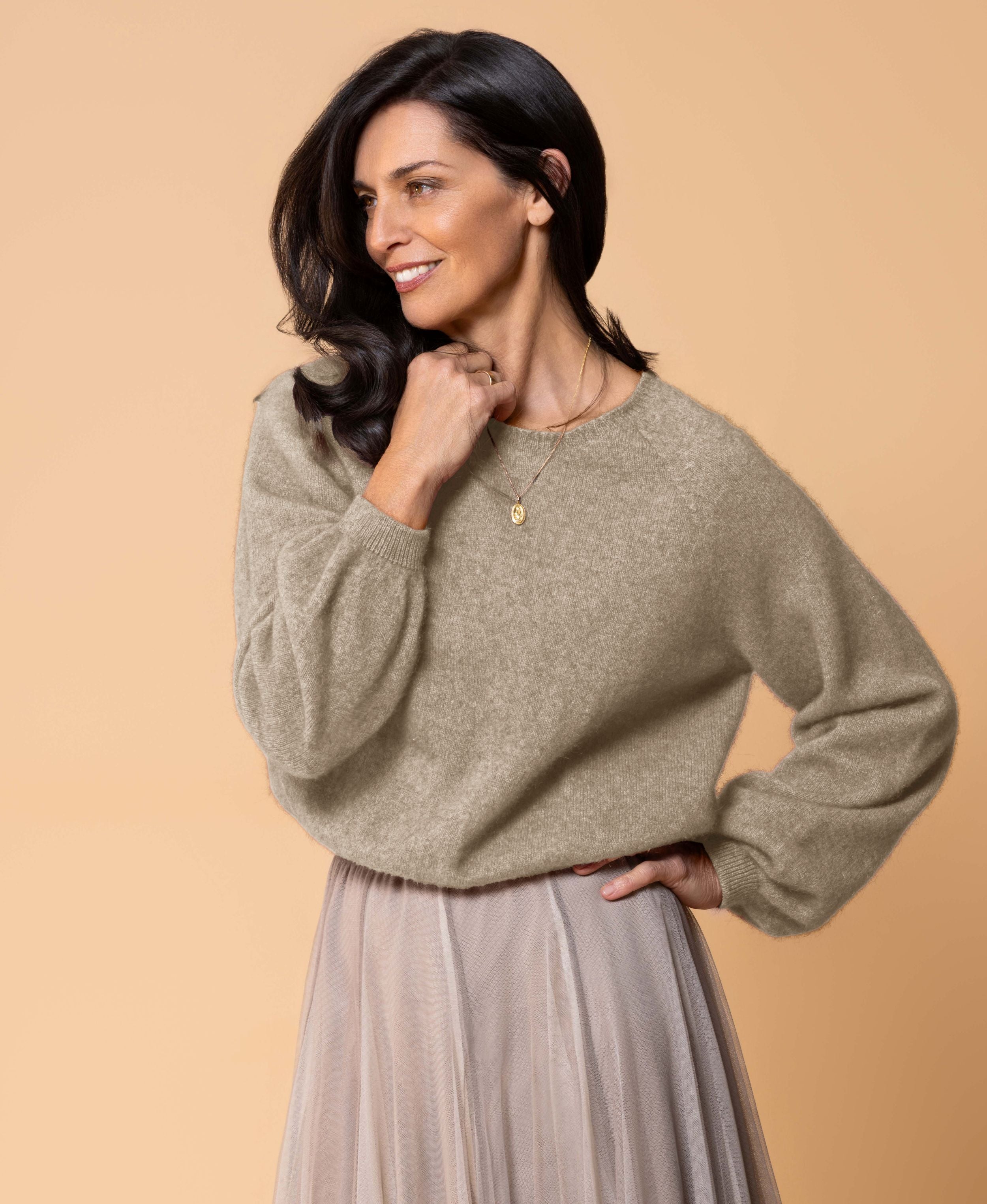 Classic button cardigan in soft possum merino blend with clean neckline and fitted shape