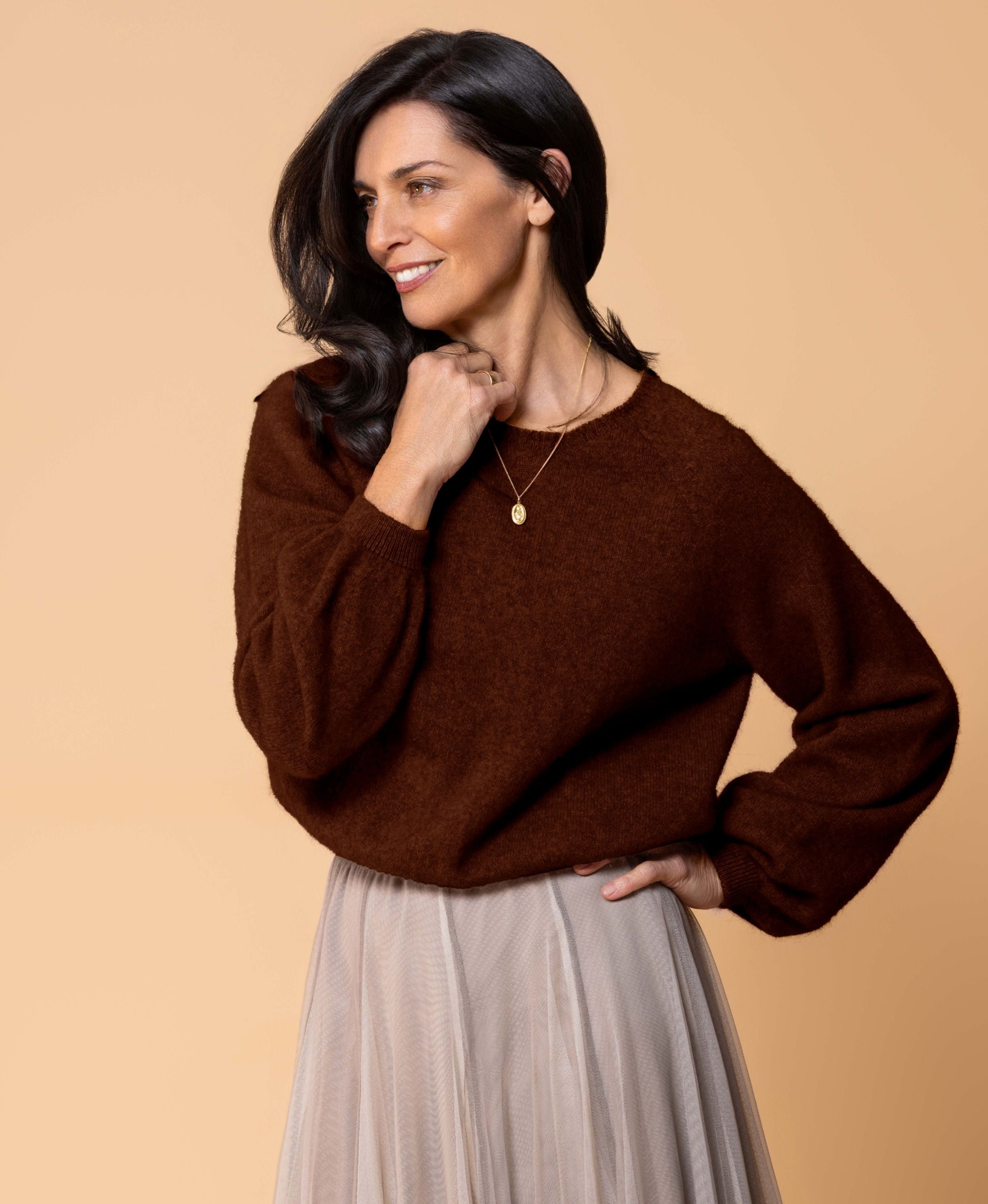 Classic button cardigan in soft possum merino blend with clean neckline and fitted shape