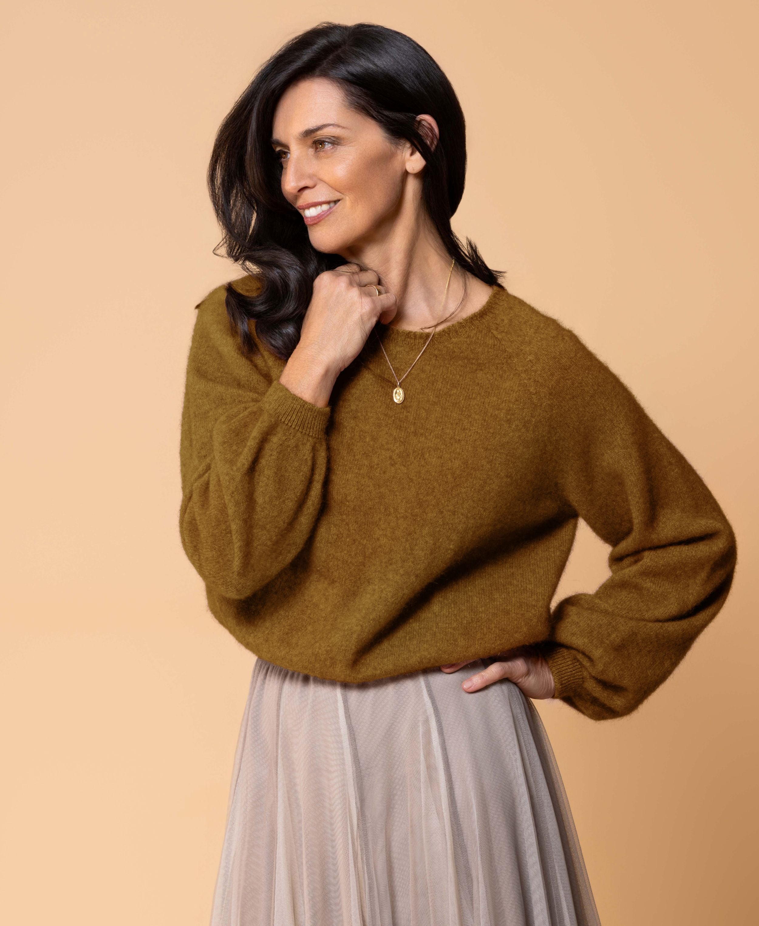 Classic button cardigan in soft possum merino blend with clean neckline and fitted shape