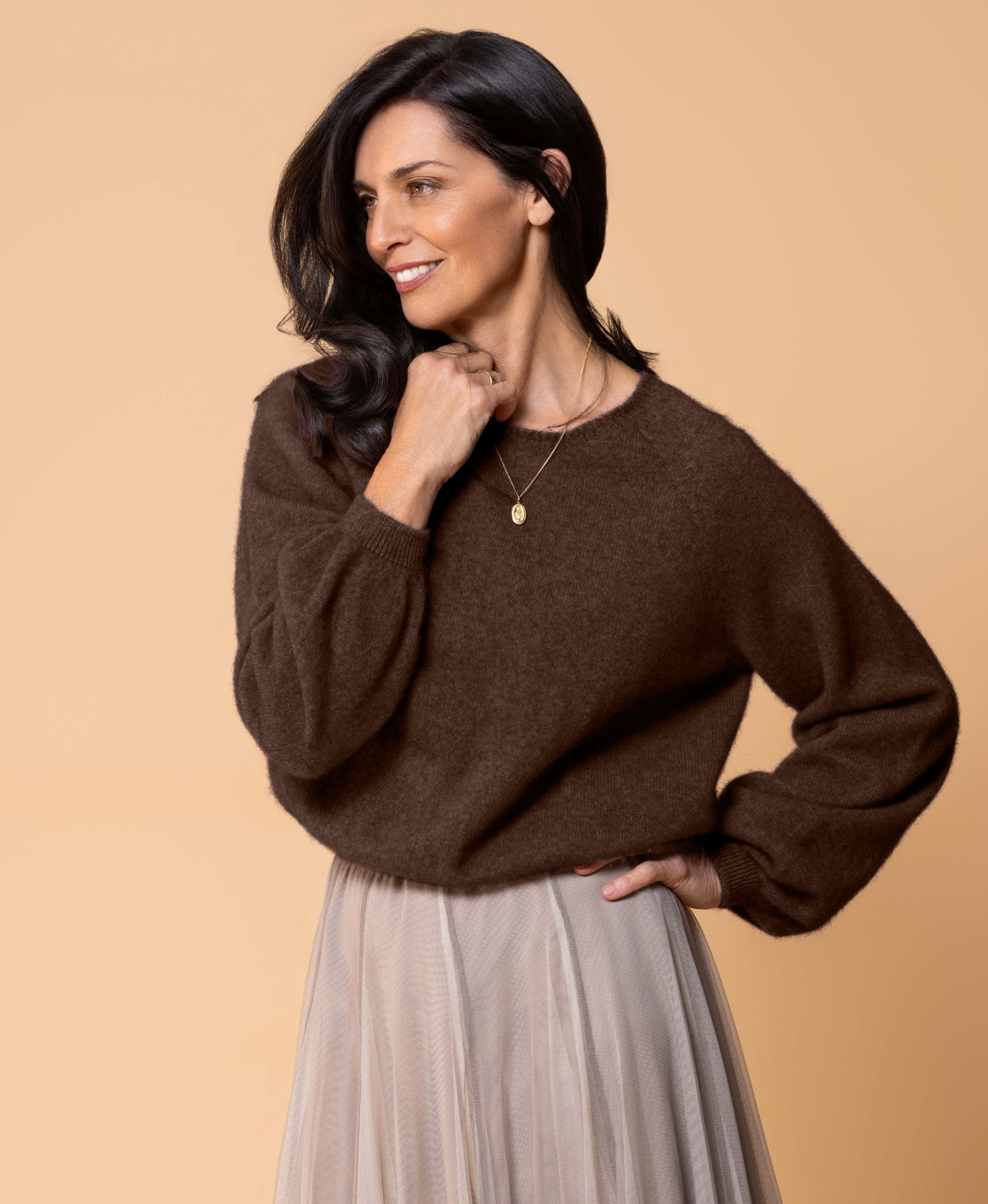 Classic button cardigan in soft possum merino blend with clean neckline and fitted shape
