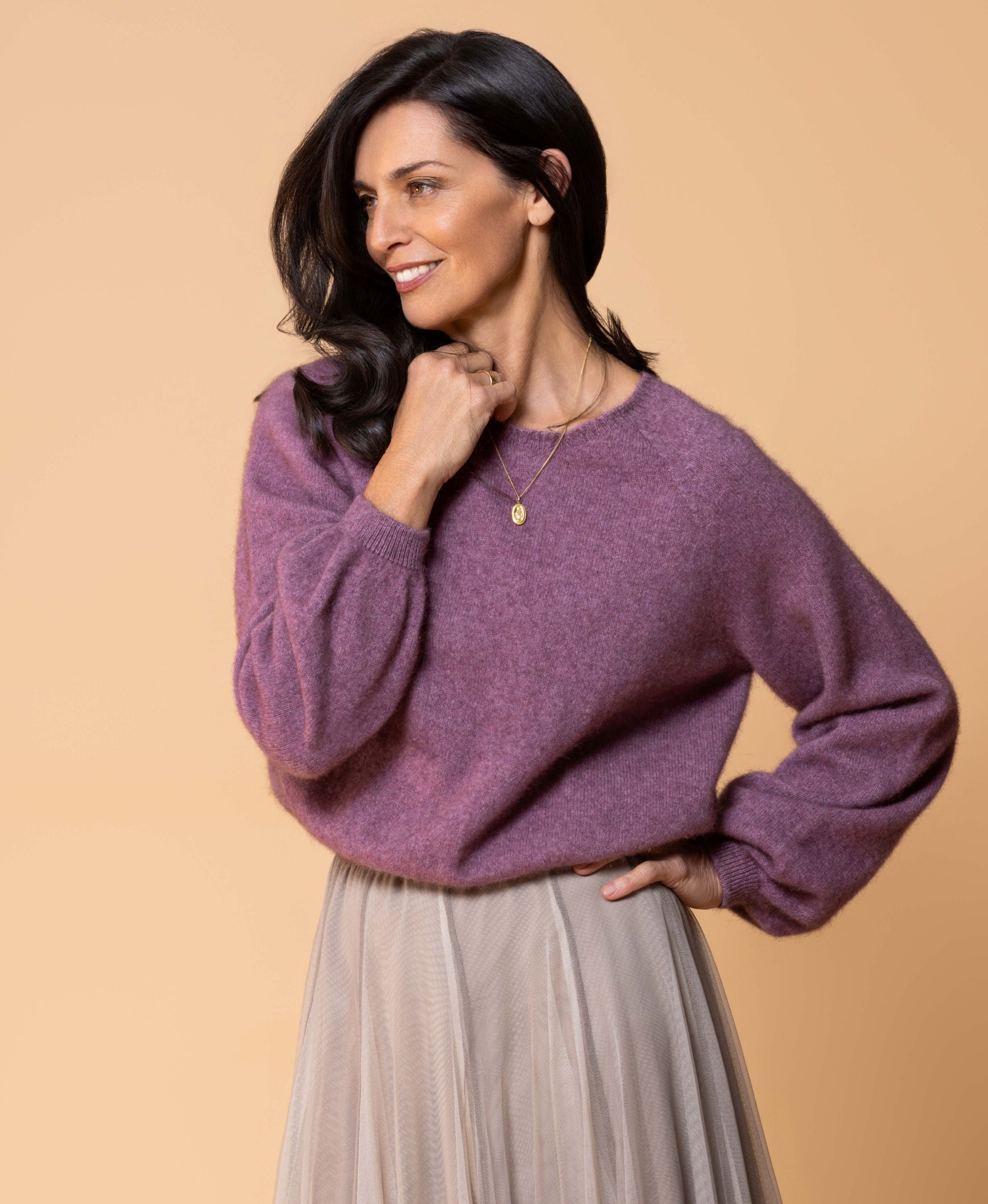 Classic button cardigan in soft possum merino blend with clean neckline and fitted shape