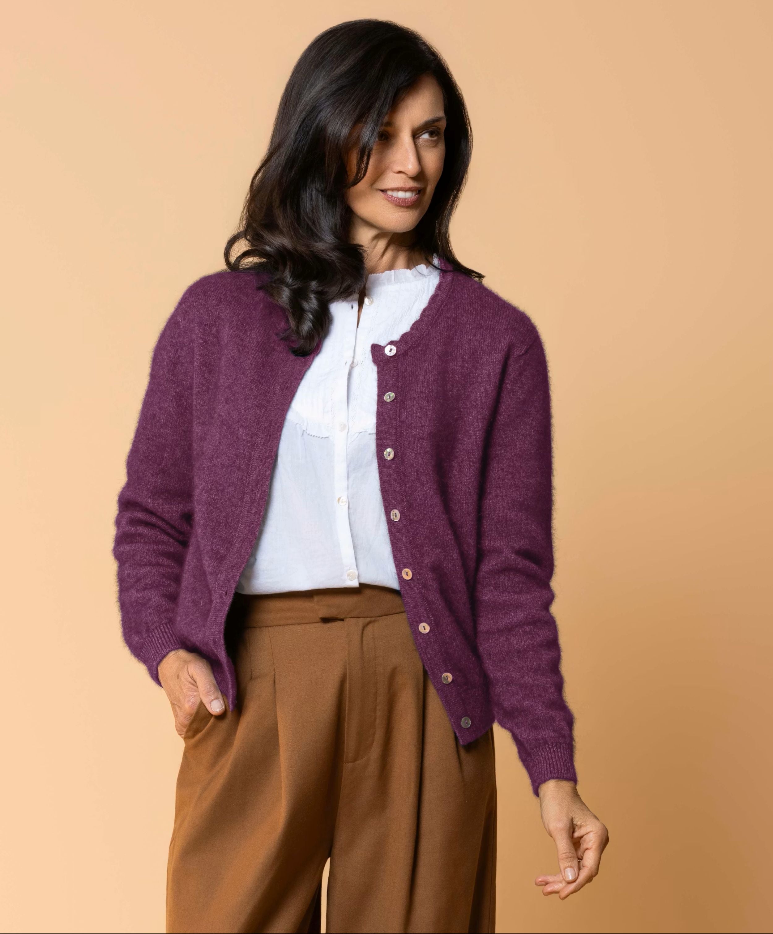 Women's Celeste Cardigan in a luxurious possum merino blend, featuring a feminine scalloped neckline, natural paua shell button front, long sleeves and a classic fit for elegant everyday layering.