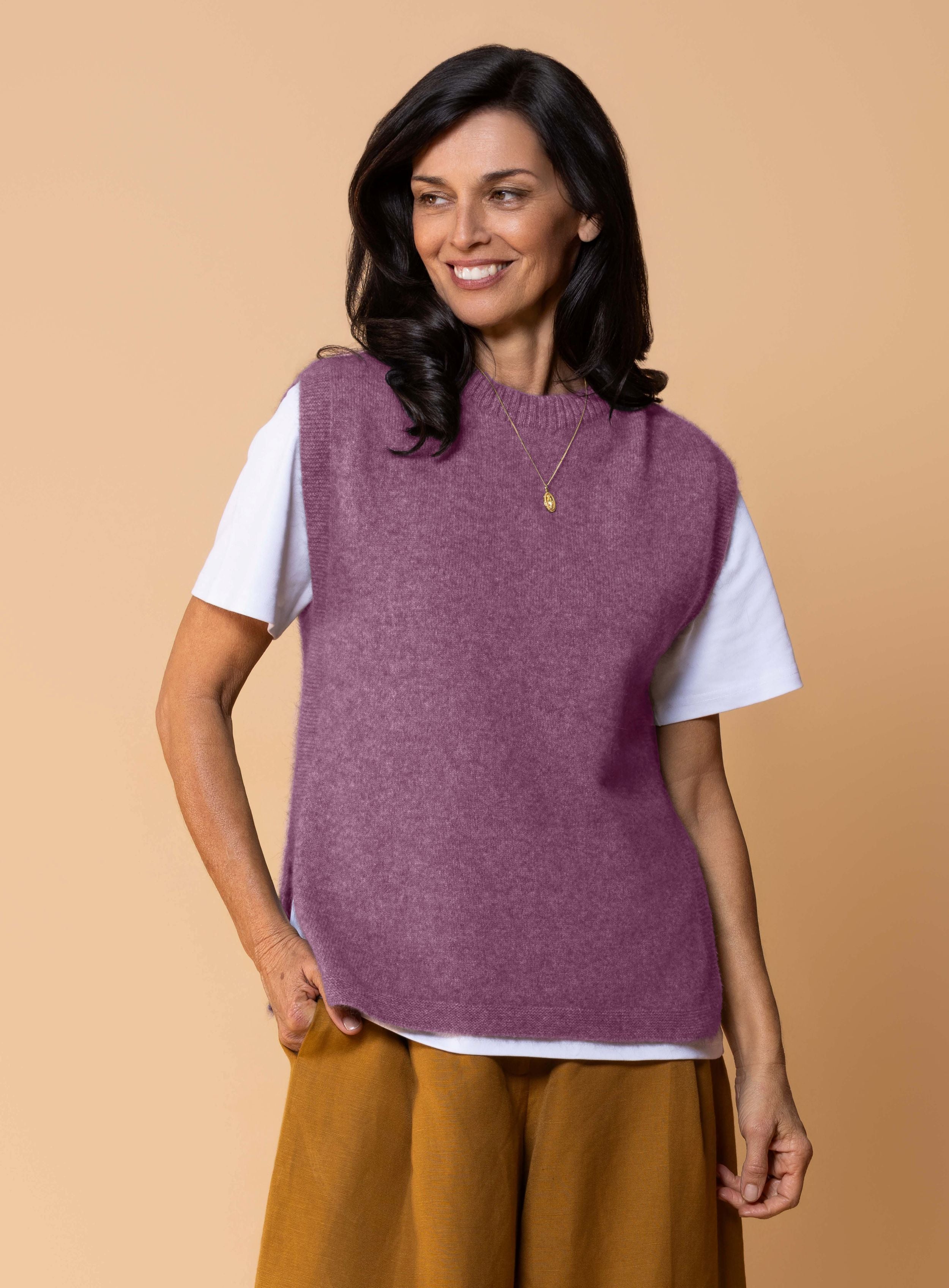 Women's Kowhai Vest in Mauve, soft dusty mauve possum merino knit sleeveless vest with round neckline, side splits and relaxed fit for layering.