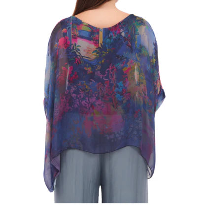 Blue Italian silk top with a relaxed fit and soft drape, lightweight and elegant with a fluid silhouette.