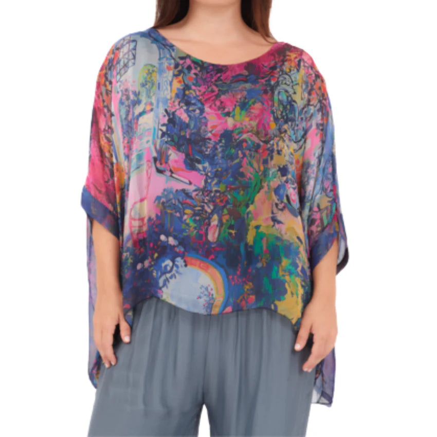 Blue Italian silk top with a relaxed fit and soft drape, lightweight and elegant with a fluid silhouette.