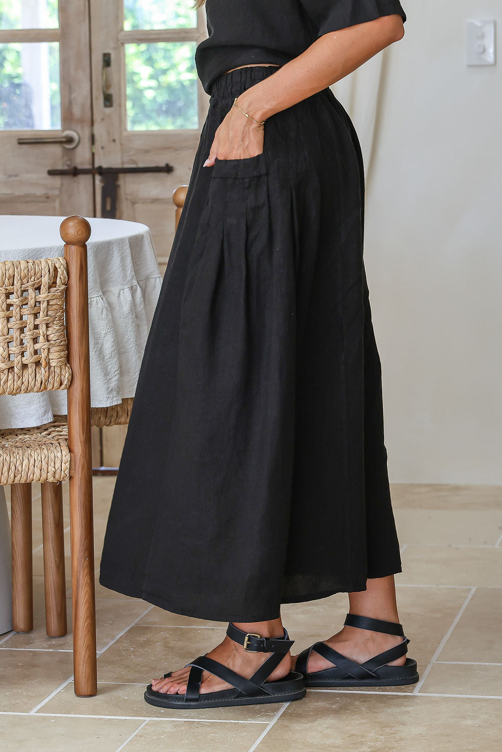 Black linen skirt with flowing silhouette and soft breathable drape