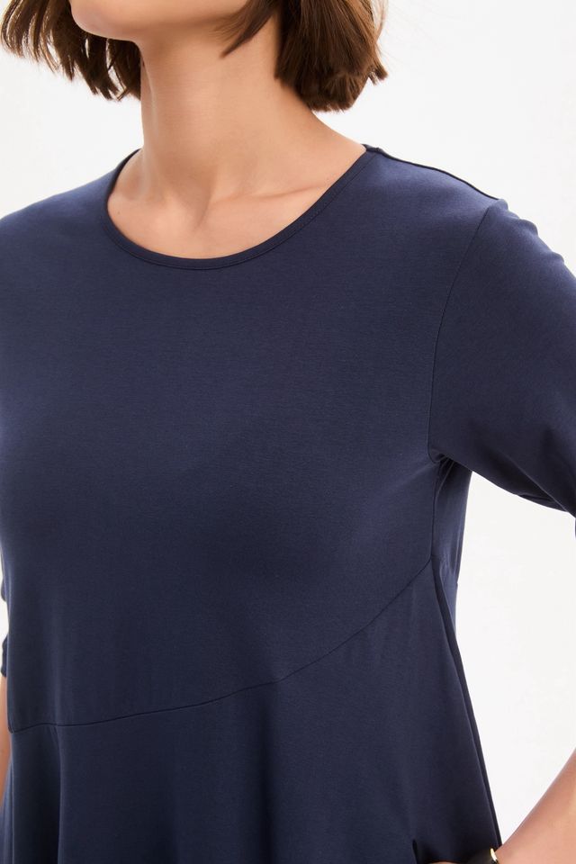 Tirelli Diagonal Seam Winter Dress in navy featuring a midi-length silhouette, diagonal seam detailing, rounded bubble hem, round neckline, and side pockets