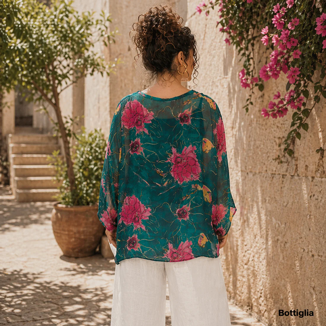 Bottiglia green Italian silk button-up top with a V-neckline, relaxed fit, and soft flowing overlay in a deep green tone.