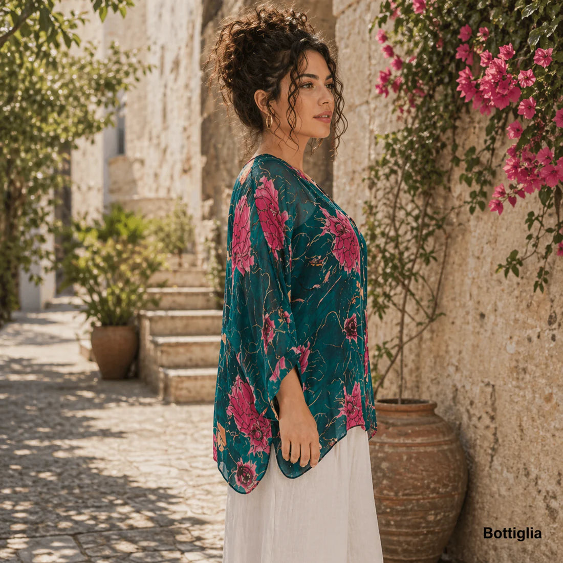 Bottiglia green Italian silk button-up top with a V-neckline, relaxed fit, and soft flowing overlay in a deep green tone.