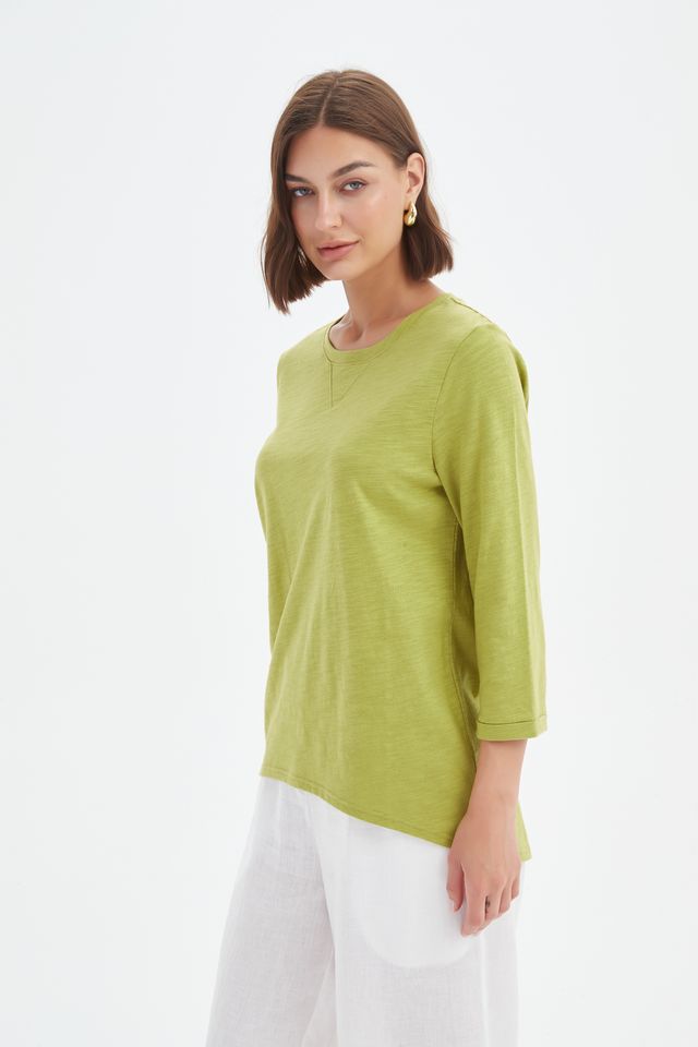 Chartreuse cotton slub tee featuring a round neckline with V-insert detail, 3/4 sleeves, relaxed fit, and curved hem.