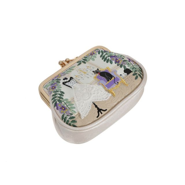 Vendula London The Wedding Shop Clipper Coin Purse in printed and embossed vegan leather, featuring charming bridal shop-inspired artwork, a secure double clasp closure and two internal compartments for storing coins, cards and notes.