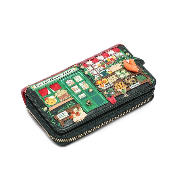 Vendula London The Farmhouse Pantry Medium Ziparound Wallet in printed and embossed vegan leather, featuring colourful countryside pantry artwork with leafy greens, strawberry reds and market-inspired details. Includes hand-stitched accents, six card slots, two note compartments, an internal zipped pocket and secure ziparound fastening
