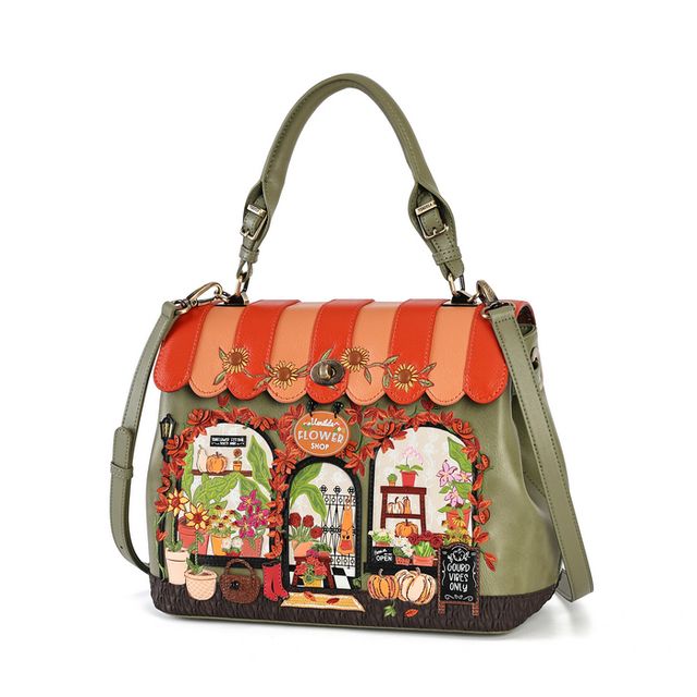 Vendula London Flower Shop Amber Edition Grace Bag in printed and embossed vegan leather, featuring an autumn flower shop scene with sunflower yellows, leafy greens, pumpkin-orange accents and colourful floral displays. Designed with hand-stitched details, a branded turn-lock, comfortable carry handle, detachable adjustable shoulder strap, secure zip closure, internal pockets and an external back zipped pocket.