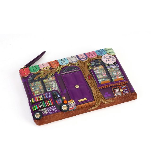 Vendula London The Travelling Library Bookshop Zipper Coin Purse in printed and embossed vegan leather, featuring charming travelling library artwork with book-inspired details and coordinating colours. Designed with hand-stitched accents, a secure zip closure, three card slots, an attached keychain and iconic Vendula London patterned lining.