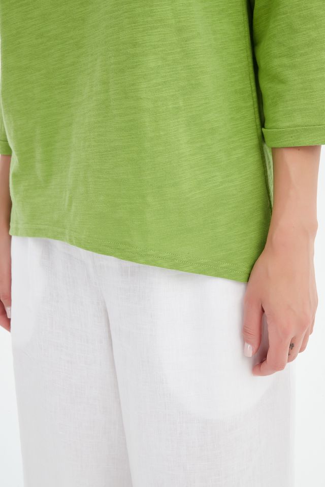Fern Green cotton slub tee featuring a round neckline with V-insert detail, 3/4 sleeves, relaxed fit, and curved hem.
