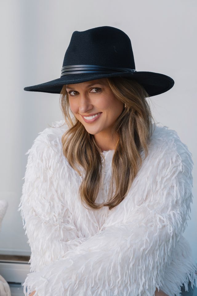 Black wool felt hat with soft structured crown and medium brim, classic neutral styling.