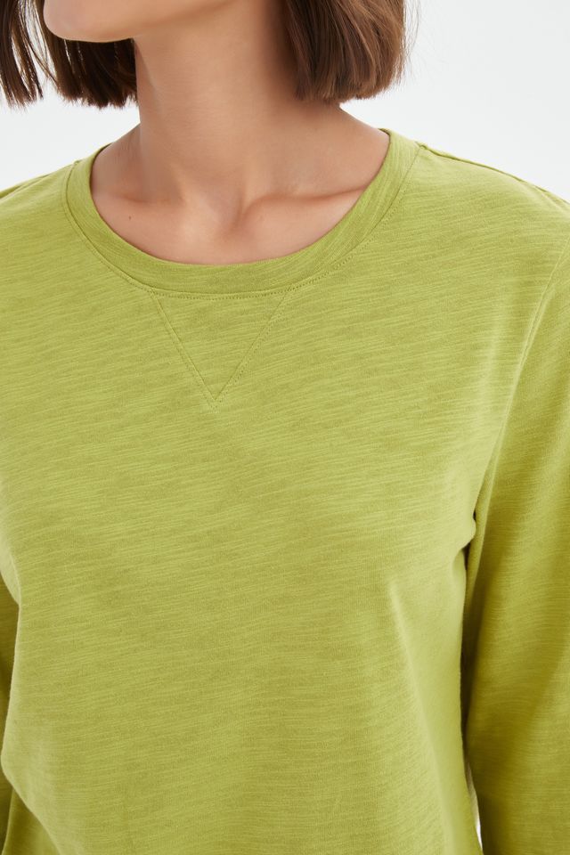 Chartreuse cotton slub tee featuring a round neckline with V-insert detail, 3/4 sleeves, relaxed fit, and curved hem.